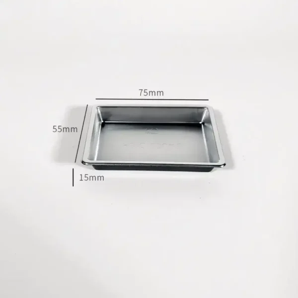 plastic-mini-tray-dimensions Close up of a silver plastic miniature tray with measurements 75mm by 55mm