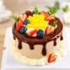 DIY Miniature Fruit Chocolate Cake Kit Finished Example Finished example of a DIY miniature fruit chocolate cake kit with chocolate drip, yellow cube accents, strawberries, blueberries, and cream-like trim